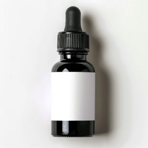 topical_liquid_medicine_in_a_plastic_black_bottle_white background